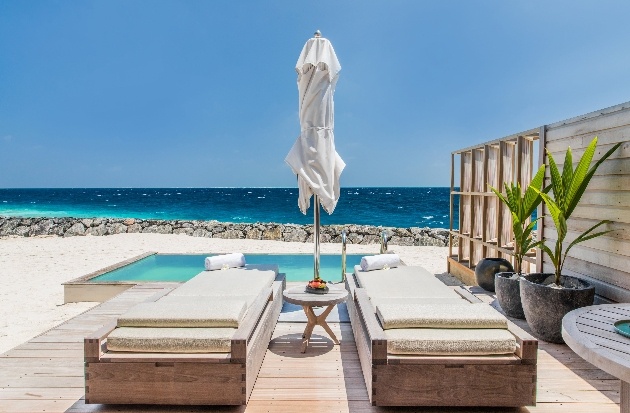 beach suite with private pool and two sun-loungers looking out to sea