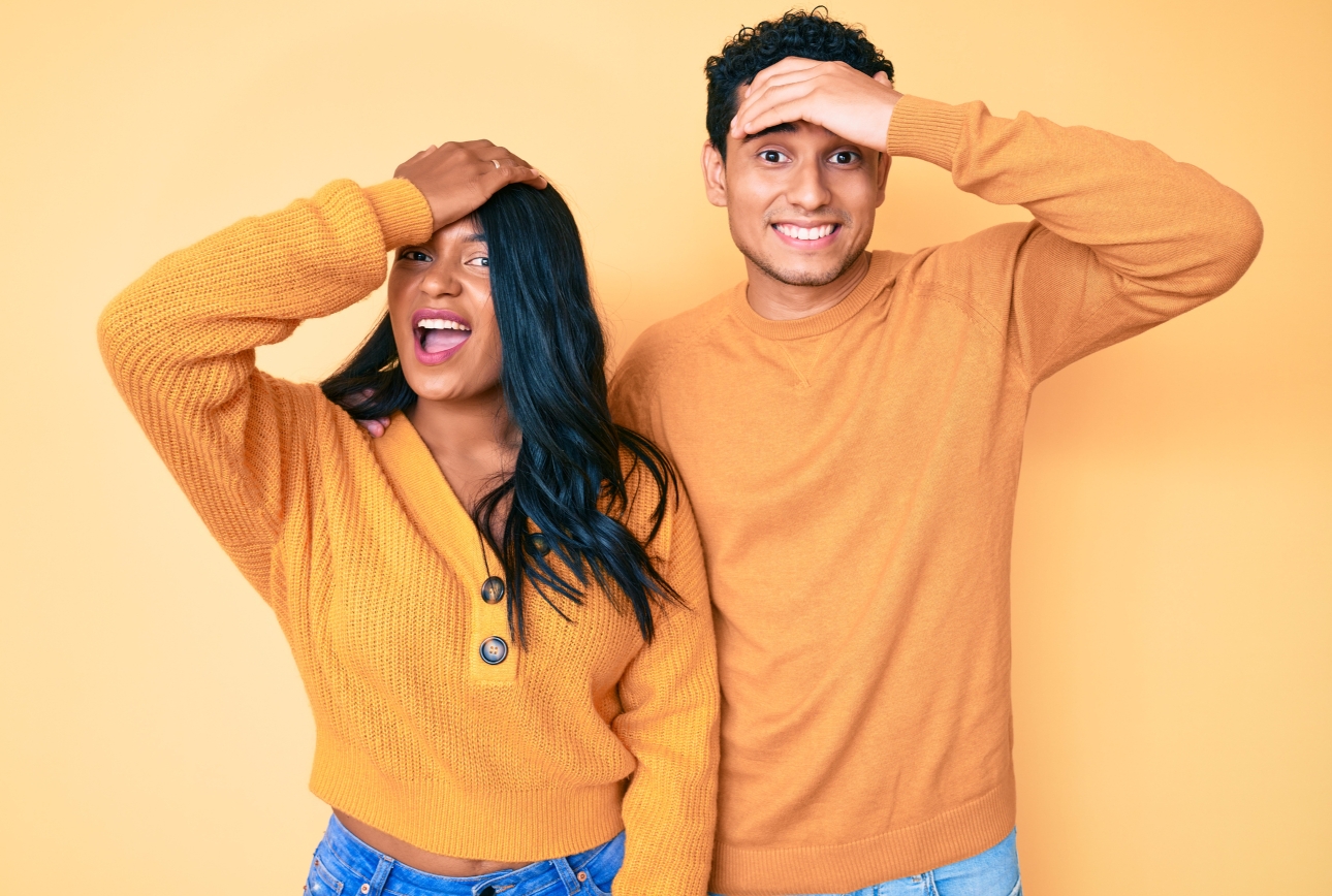 couple with hand on their heads in forgetful gesture 