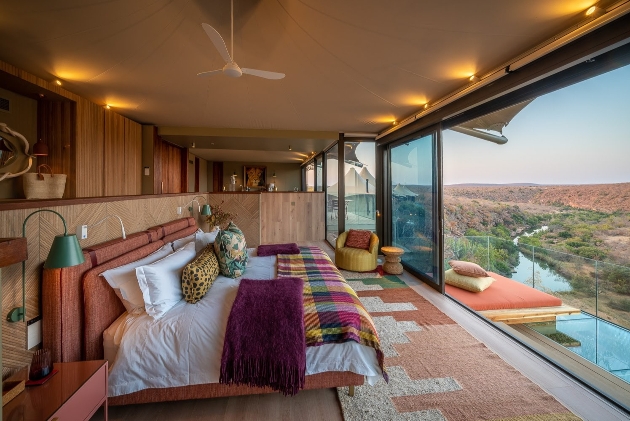 bedroom in lodge with safari views