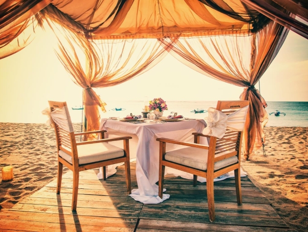 dinner table and chairs on beach 