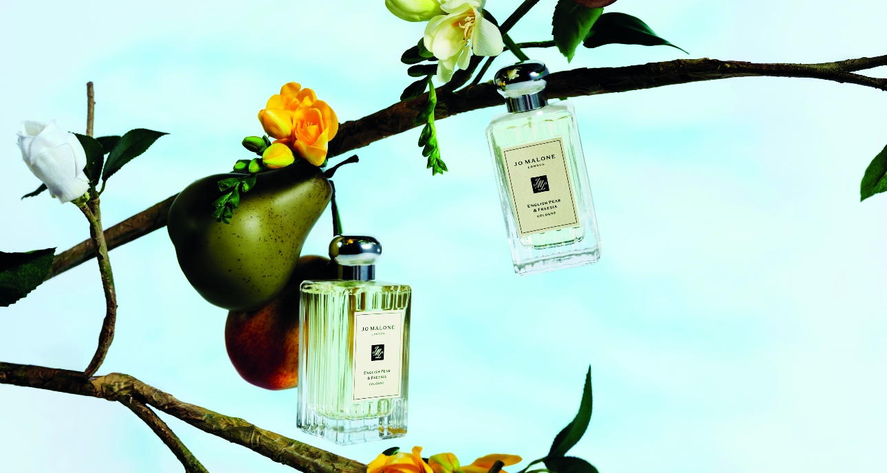 new Jo Malone Pear and Freesia colognes hanging from a pear treee