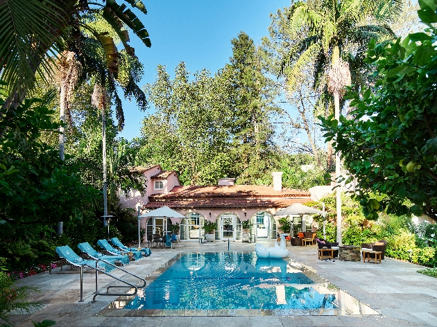 Hotel Bel-Air garden view with palm trees and pool