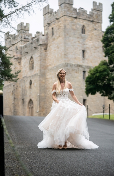 Langley Castle with a bride walking down the driveway