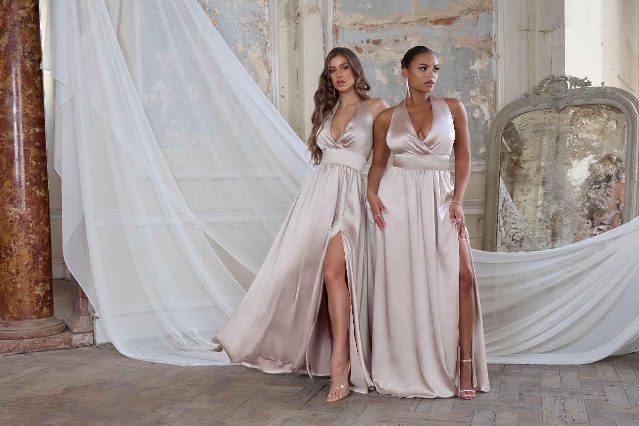 two models in champagne satin bridesmaids gowns