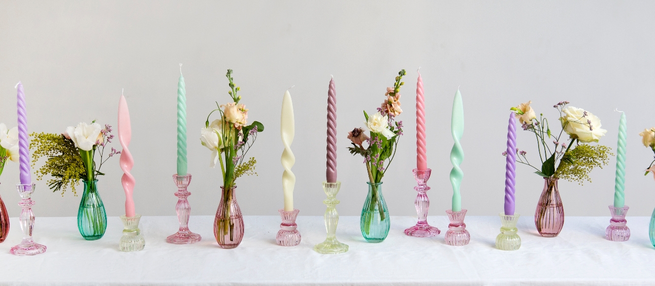 multicoloured candles and vases