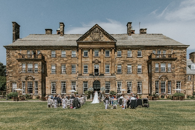 Crathorne Hall's outdoor wedding sunny day in front of historic building