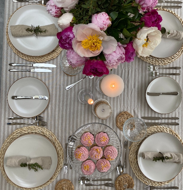plain dinnerware with cupcakes and flowers in picture