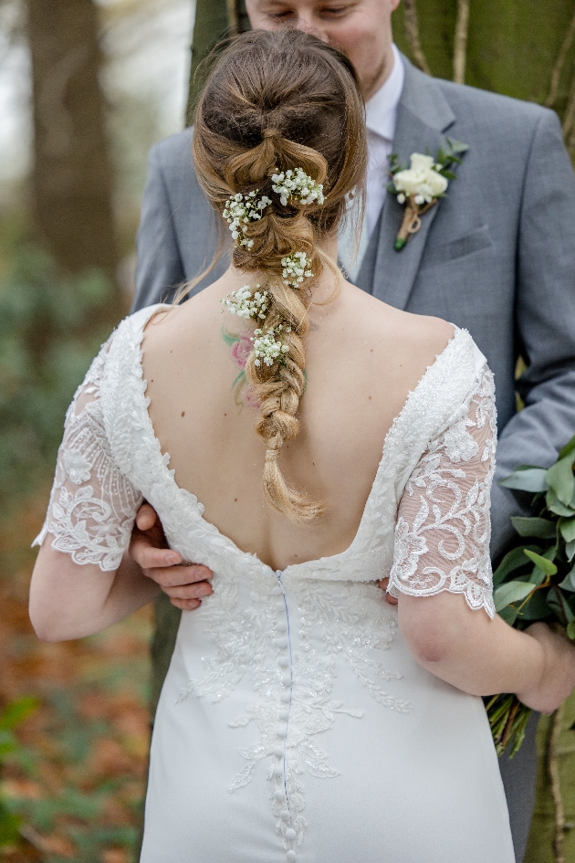 bride with her back to camera with fishtail plait